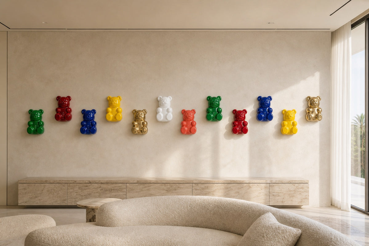 Twelve gummy bear wall pieces in a zigzag run across a wide villa living room wall