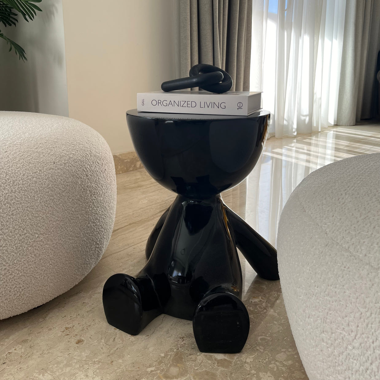 Noir half head side table