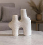 Handmade White Pottery Vase on a marble surface with a neutral background