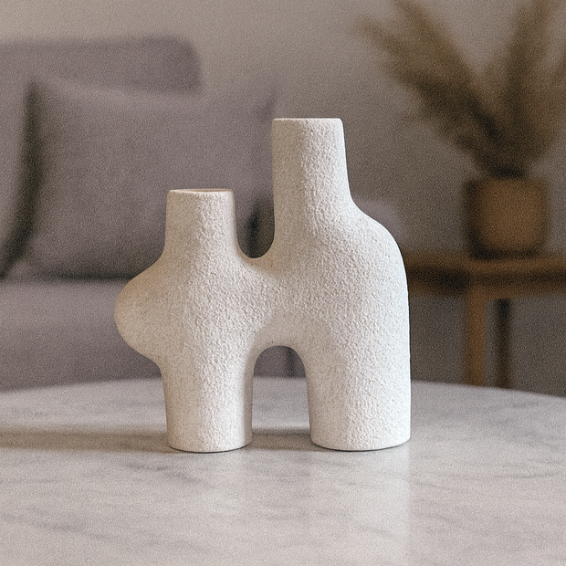 Handmade White Pottery Vase on a marble surface with a neutral background